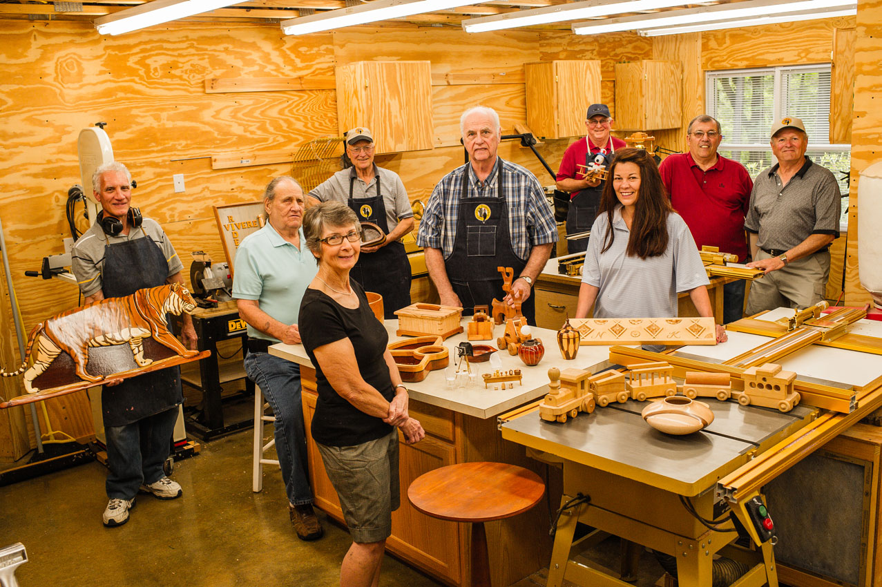 Members of Tellico Village Woodworkers Clubs showcasing their creations.
